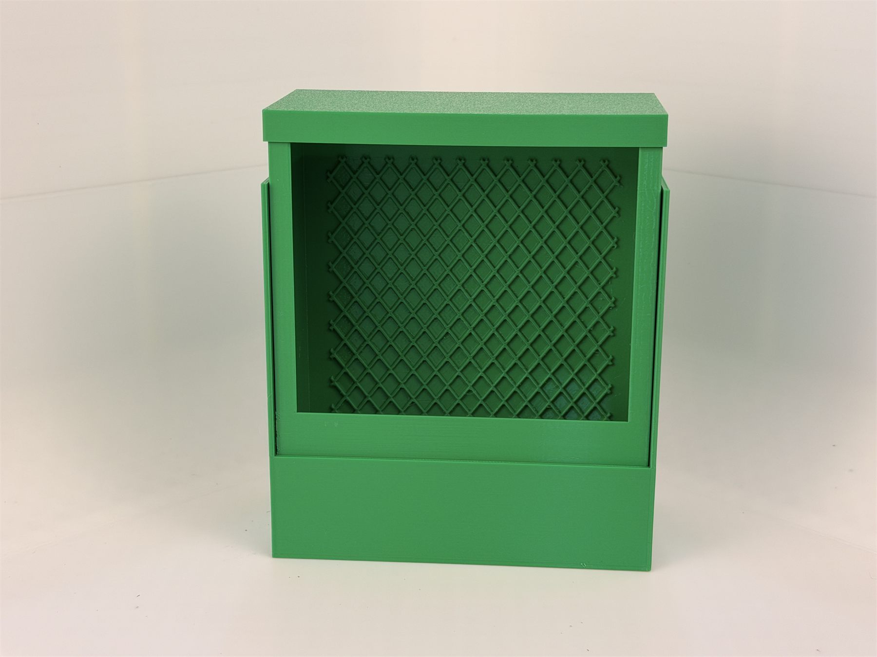 Green chameleon feeder system viewed from an angle