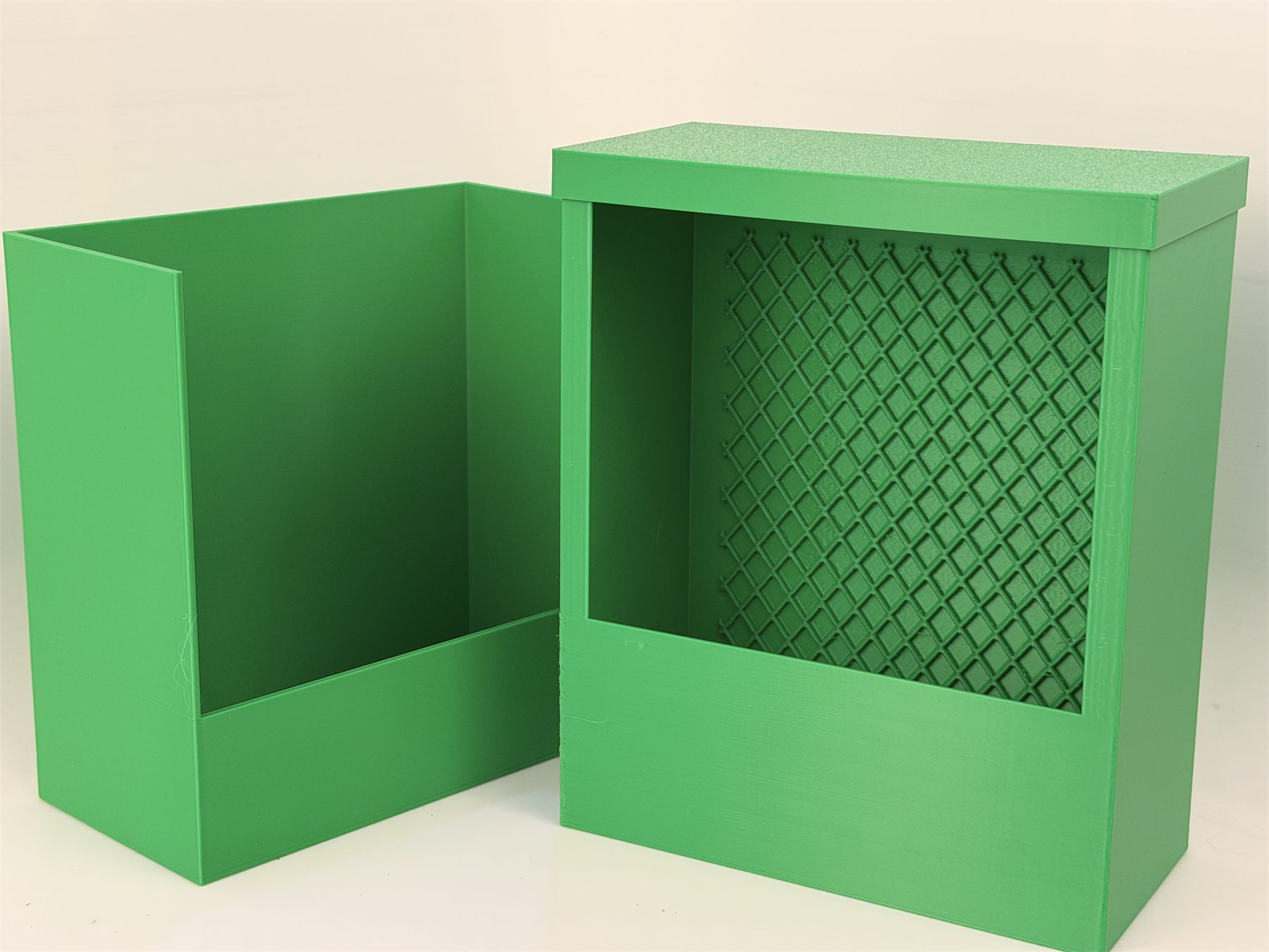 Green feeder box shown separated from its wall mount